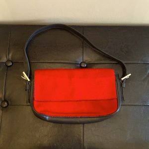 Roots faux pony bag. Red. 10.5 in x 6.5 in. Excellent condition.